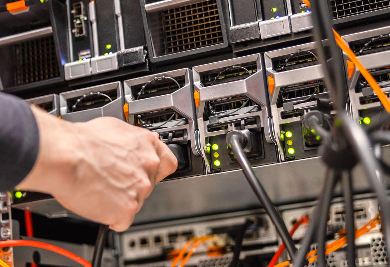Technician connecting data-centre servers